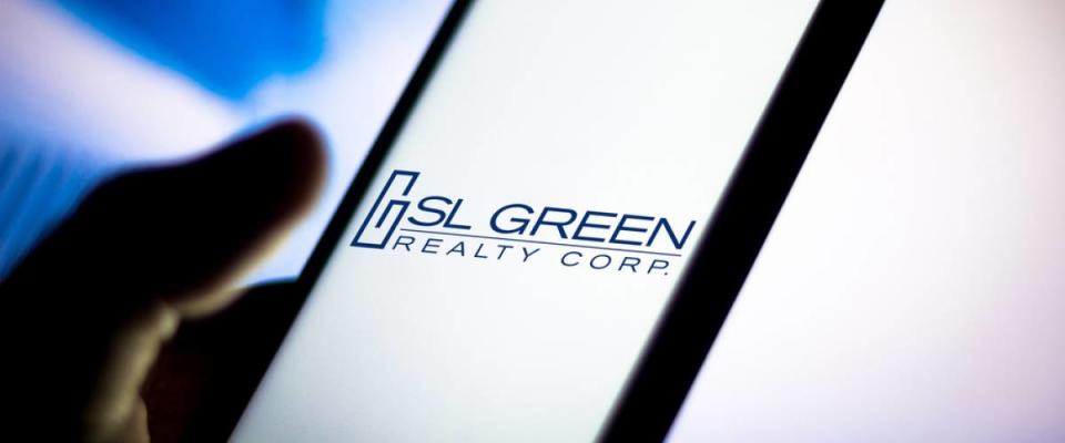 In this photo illustration the SL Green Realty logo seen displayed on a smartphone