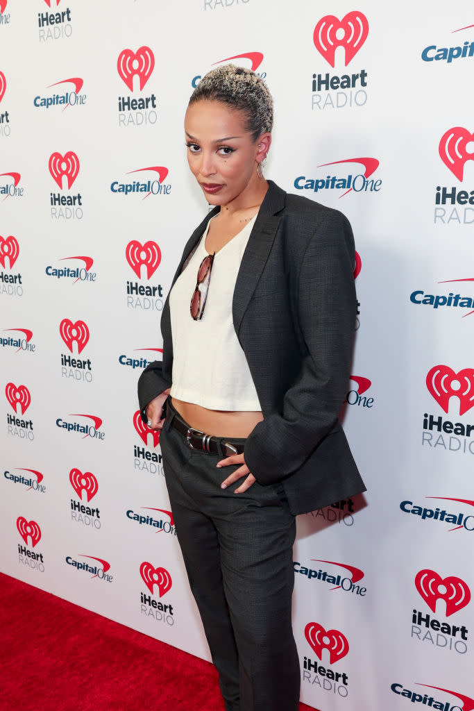 Doja Cat at the iHeartRadio Music Festival on Sept. 21 in Las Vegas, red carpet, gray suit