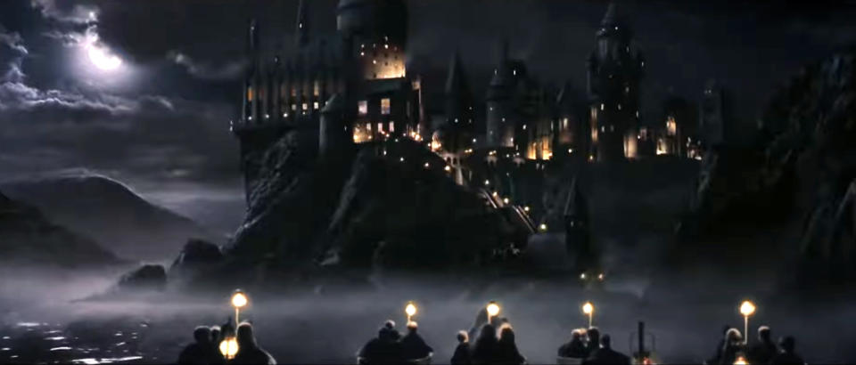 children boat toward Hogwarts