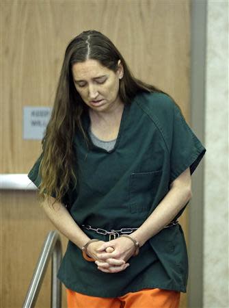 Megan Huntsman enters the courtroom in Provo, Utah April 21, 2014. REUTERS/Rick Bowmer/Pool