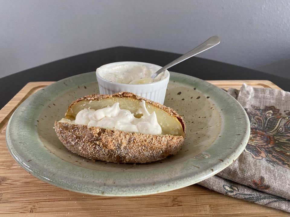 completed guy fieri baked potato recipe with horseradish sour cream