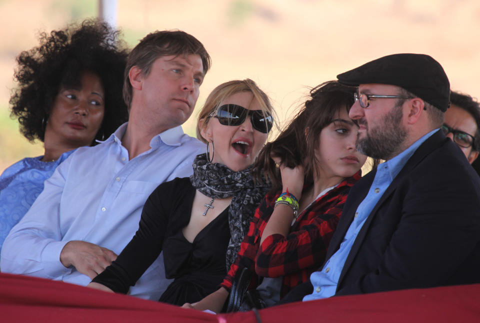 FILE - In this Oct. 26, 2009 file photo, US pop star Madonna attends the ground breaking ceremony for the Raising Malawi Academy for Girls in Lilongwe, Malawi. In 2009, George Chaponda, the education minister, helped Madonna break ground for a $15 million academy for girls. Early 2012, Madonna's Raising Malawi foundation announced that instead of building the multimillion-dollar academy, it is providing $300,000 to the non-governmental organization buildOn, which has years of experience in Malawi, to develop 10 schools. They'll serve about 1,000 boys and girls in the southern African nation of 15 million that is among the poorest in the world. (AP Photo/file/Tsvangirayi Mukwazhi, File)