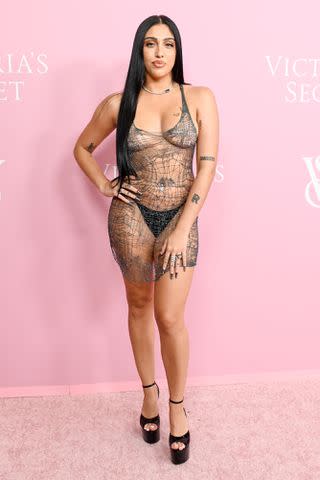 <p>Gilbert Flores/WWD via Getty</p> Lourdes Leon teamed her Natalia Fedner mini dress with a black thong and platform stiletto heels for the Victoria's Secret World Tour in New York on Wednesday.