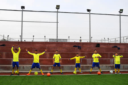 Moatasem Al-Nabeeh, 14, who is diagnosed with cancer, warms up before playing soccer with fellow cancer patients in Gaza City, February 15, 2019. REUTERS/Dylan Martinez