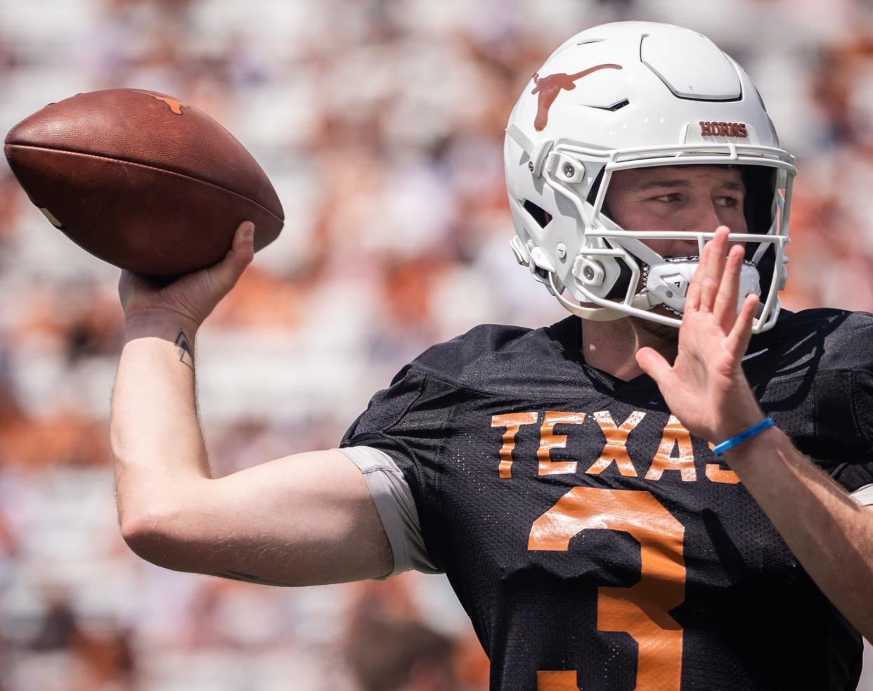 Texas quarterback Quinn Ewers (3) warms up ahead of the Longhorn's Orange and White spring football game in Darrell K Royal-Texas Memorial Stadium, Saturday, April 15, 2023.