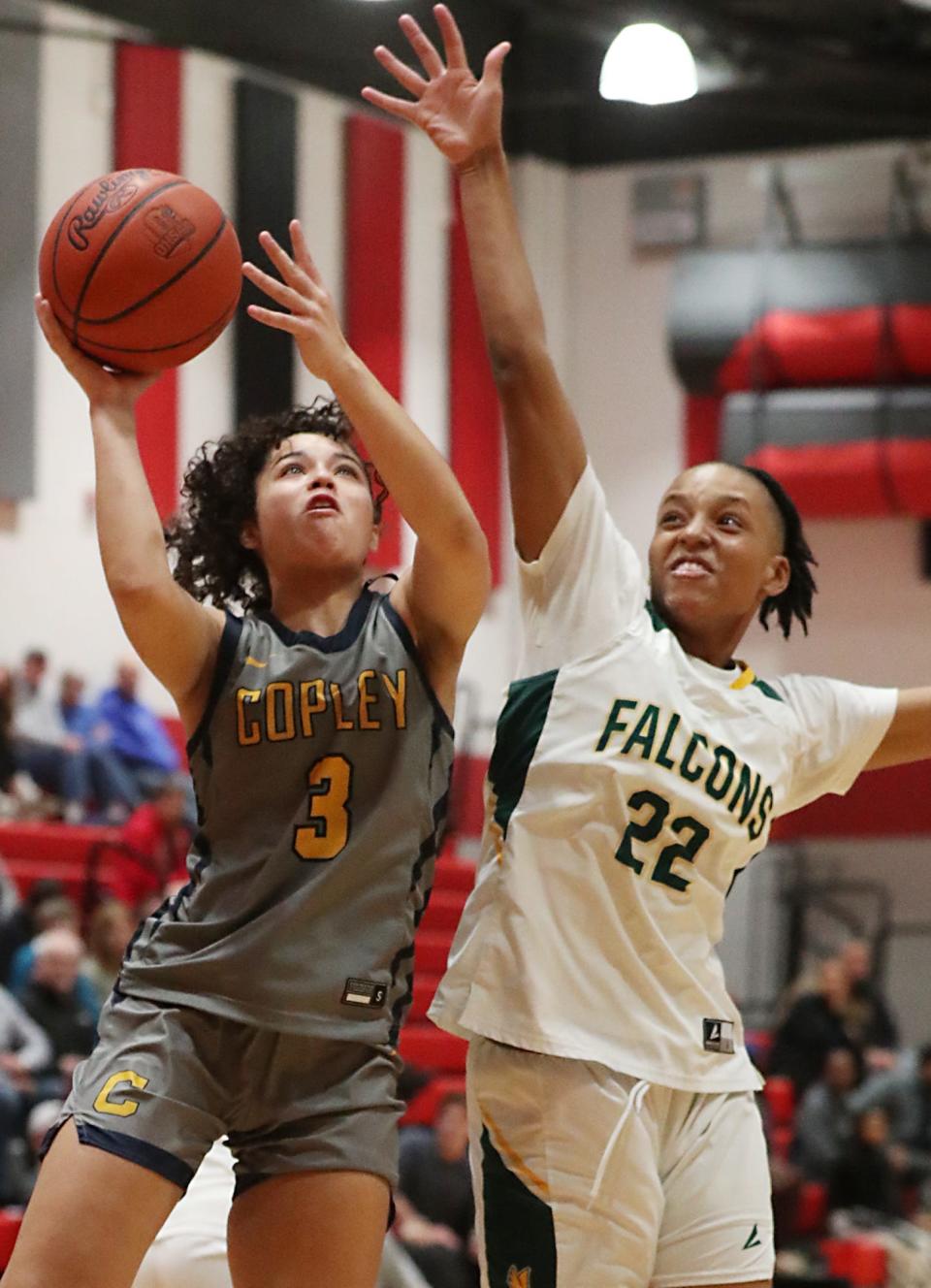 Copley's Izzy Callaway looks to shoot as Firestone's Aalivia Mullins defends during the Suburban vs. City Women's Tri-County Basket Ball Coaches Association 20204 Senior All-Star Game on Monday in Norton.