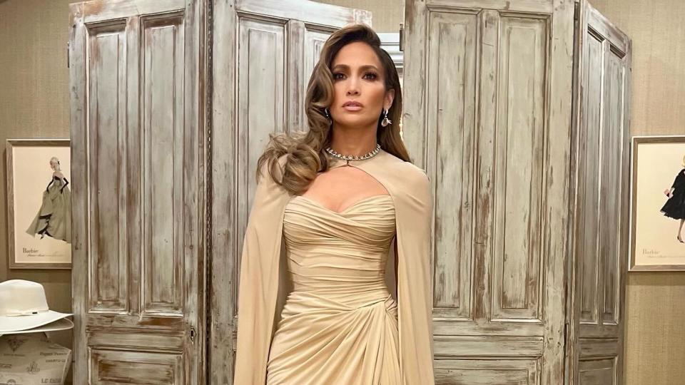 Jennifer Lopez wears a beige gown and cape look on her Instagram