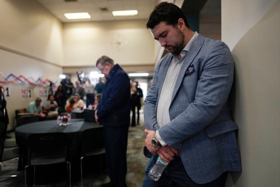 CBP Program Manager Sam Huddleston bows his head during a prayer during a watch party for opponents of Issue 1 at the Center for Christian Virtue in Columbus, Ohio, Tuesday, Nov. 7, 2023. (AP Photo/Carolyn Kaster)