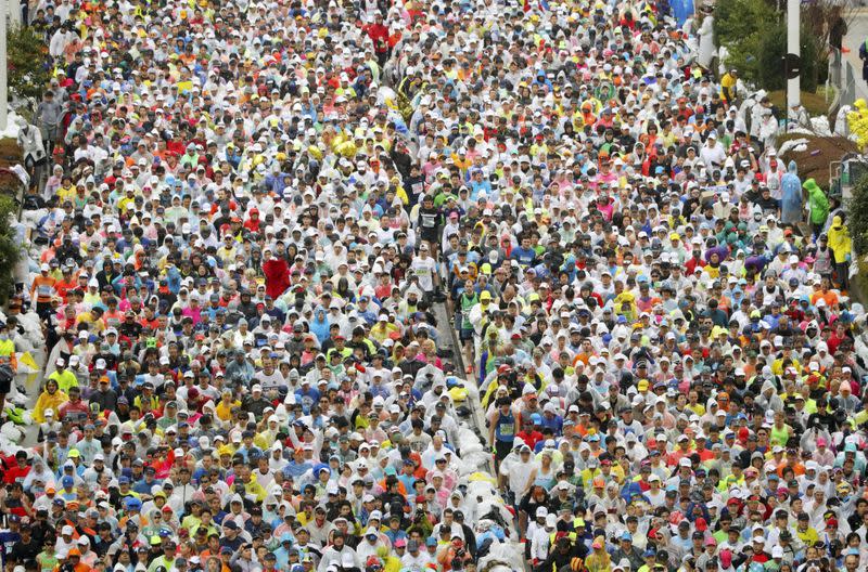 Runners fill the street at the start of the Tokyo Marathon in Tokyo,Japan