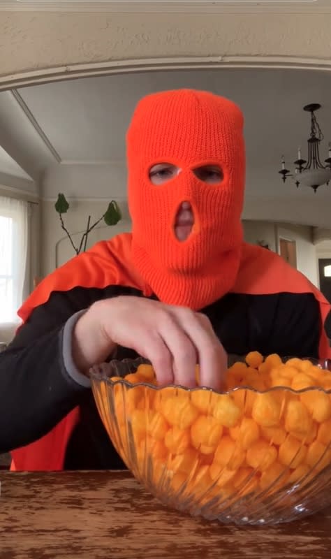 “I think everybody wants to be behind the mask,” the anonymous cheeseball eater said about his fans. TikTok / cheeseballman427