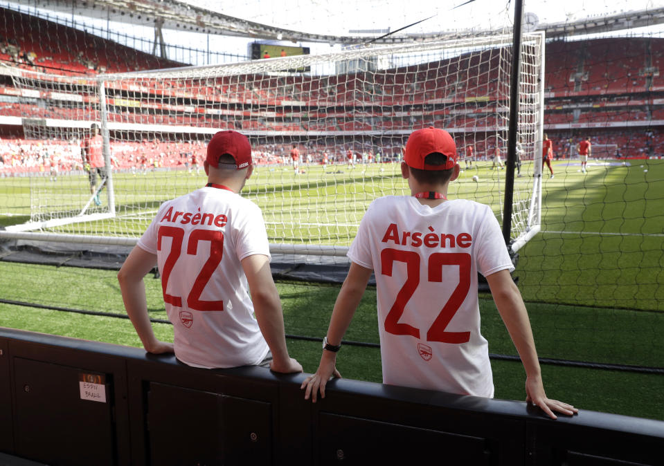 <p>Ball boys wear special t-shirts with the name of Arsene Wenger on them before the English Premier League soccer match between Arsenal and Burnley at the Emirates Stadium in London, Sunday, May 6, 2018. The match is Arsenal manager Arsene Wenger’s last home game in charge after announcing in April he will stand down as Arsenal coach at the end of the season after nearly 22 years at the helm. (AP Photo/Matt Dunham) </p>