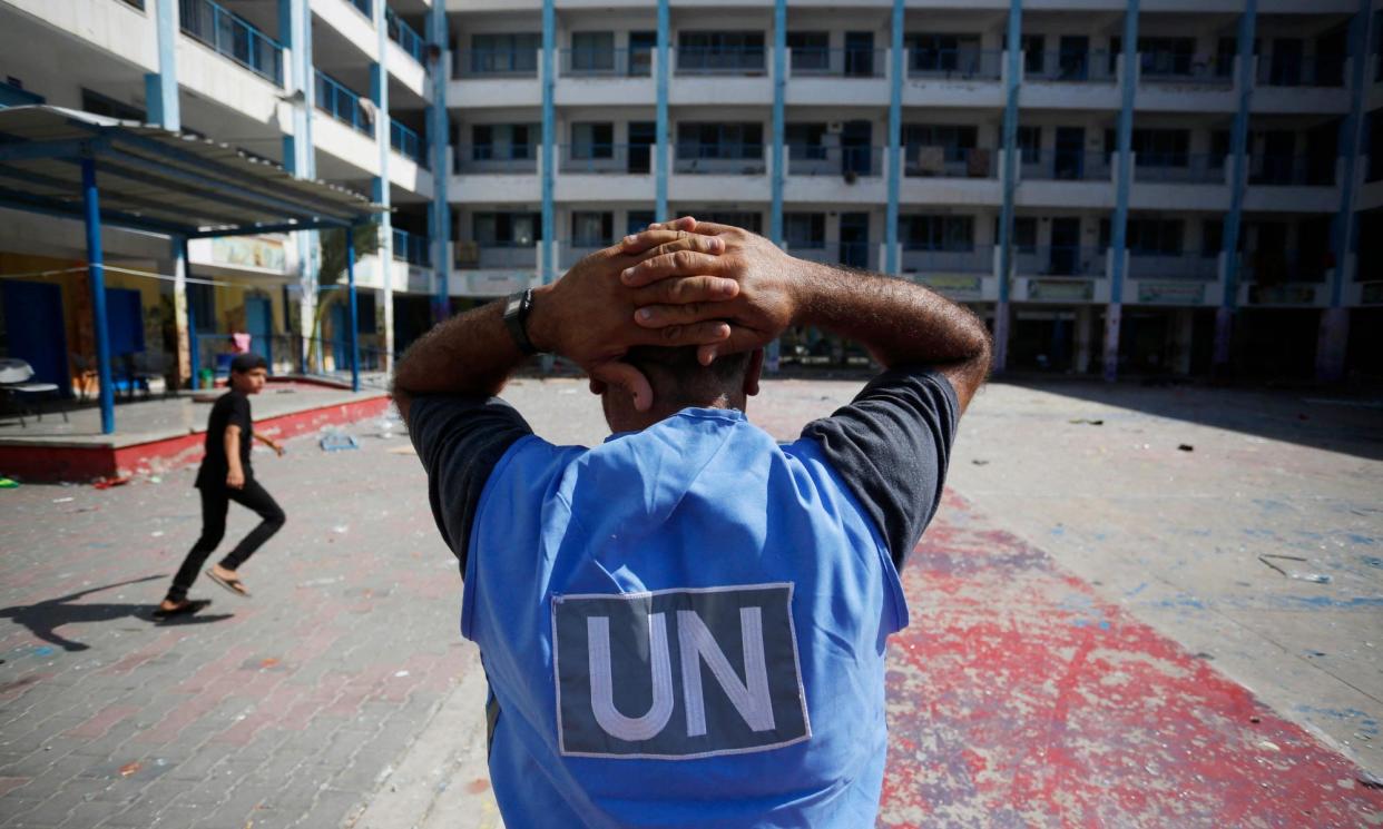 <span>A UN worker pictured in the yard of a UN-run school in Gaza. Unrwa has provided vital support to Palestinians for decades and has previously been accused by Israel of collaborating with Hamas.</span><span>Photograph: Mohammed Faiq/AFP/Getty Images</span>