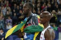 Athletics - IAAF Diamond League 2015 - Sainsbury's Anniversary Games - Queen Elizabeth Olympic Park, London, England - 24/7/15 Jamaica's Usain Bolt and Great Britain's Mo Farah before the Men's 3000m Reuters / Phil Noble Livepic