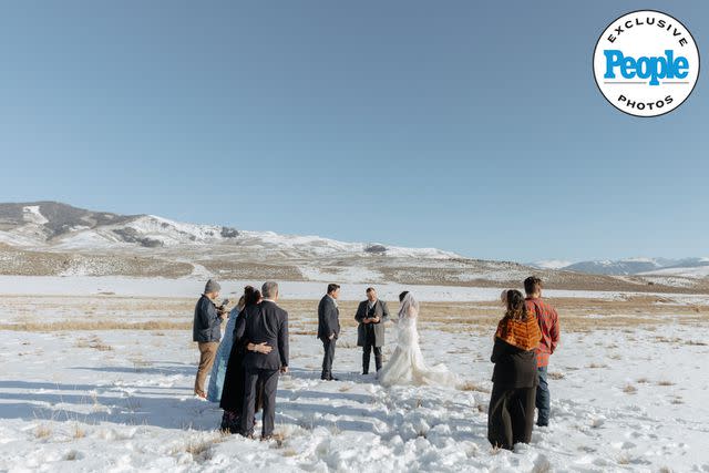 <p>markandjenna.pic-time.com</p> Ian Flanigan and wife Kelsey exchange vows in front of a small group of loved ones