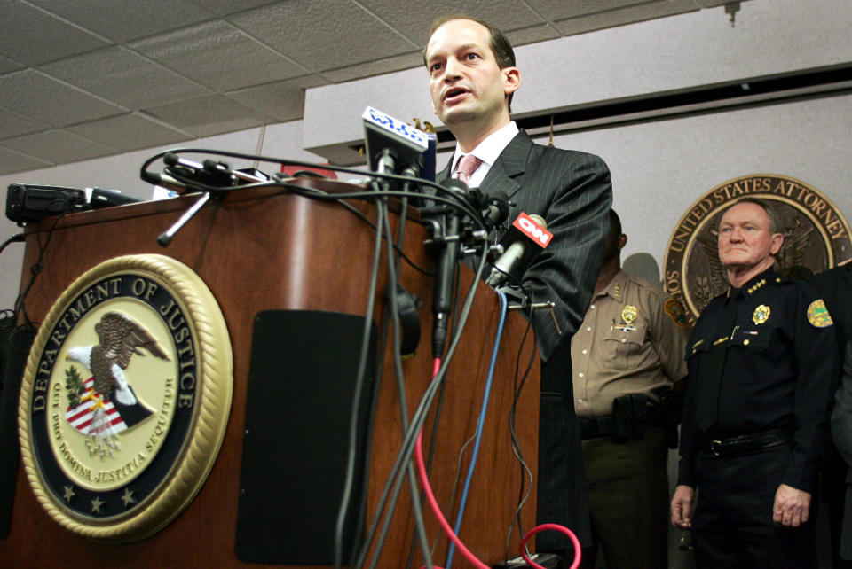 File Photo: U.S. Attorney R. Alexander Acosta (L) and other law enforcement officials hold a news conference in Miami, Florida, June 23, 2006.REUTERS/Marc Serota/File Photo