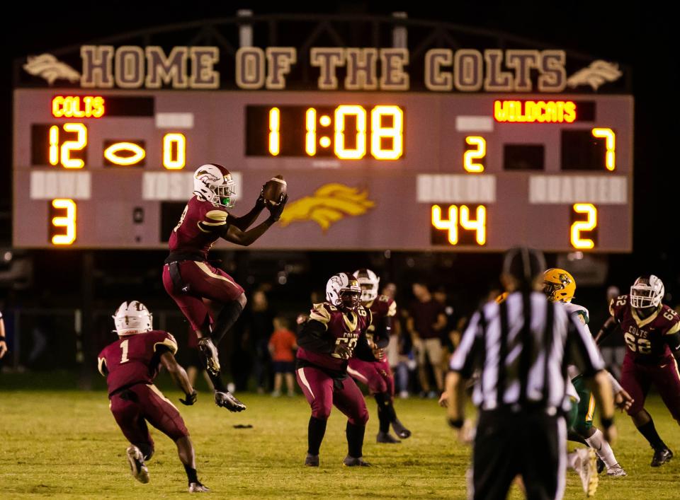 North Marion wide receiver Caleb Rollerson (8) hauls in a reception for a gain in the first half against the Forest Wildcats in Week 1 of high school football Friday night, Aug. 26, 2022 in Citra, at Stan Toole Stadium.