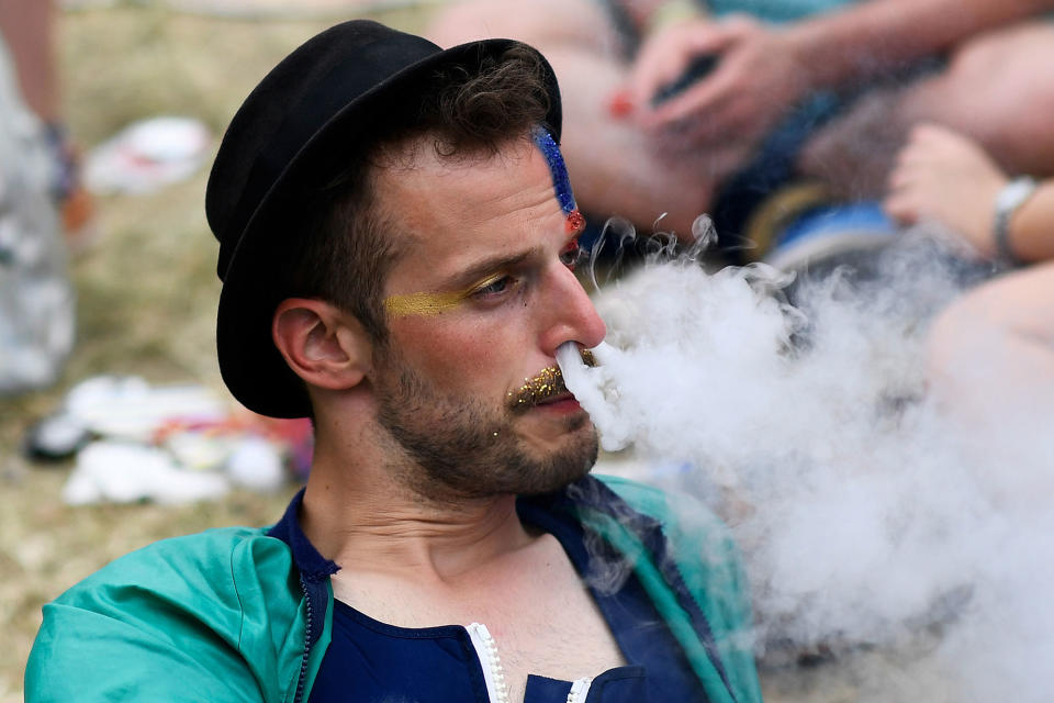 <p>A reveller exhales at Worthy Farm in Somerset during the Glastonbury Festival, Britain, June 23, 2017. (Photo: Dylan Martinez/Reuters) </p>