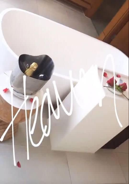 Jesinta shared this photo of the rose petal lined bath to give followers a real insight into her romantic escape. Source: Instagram