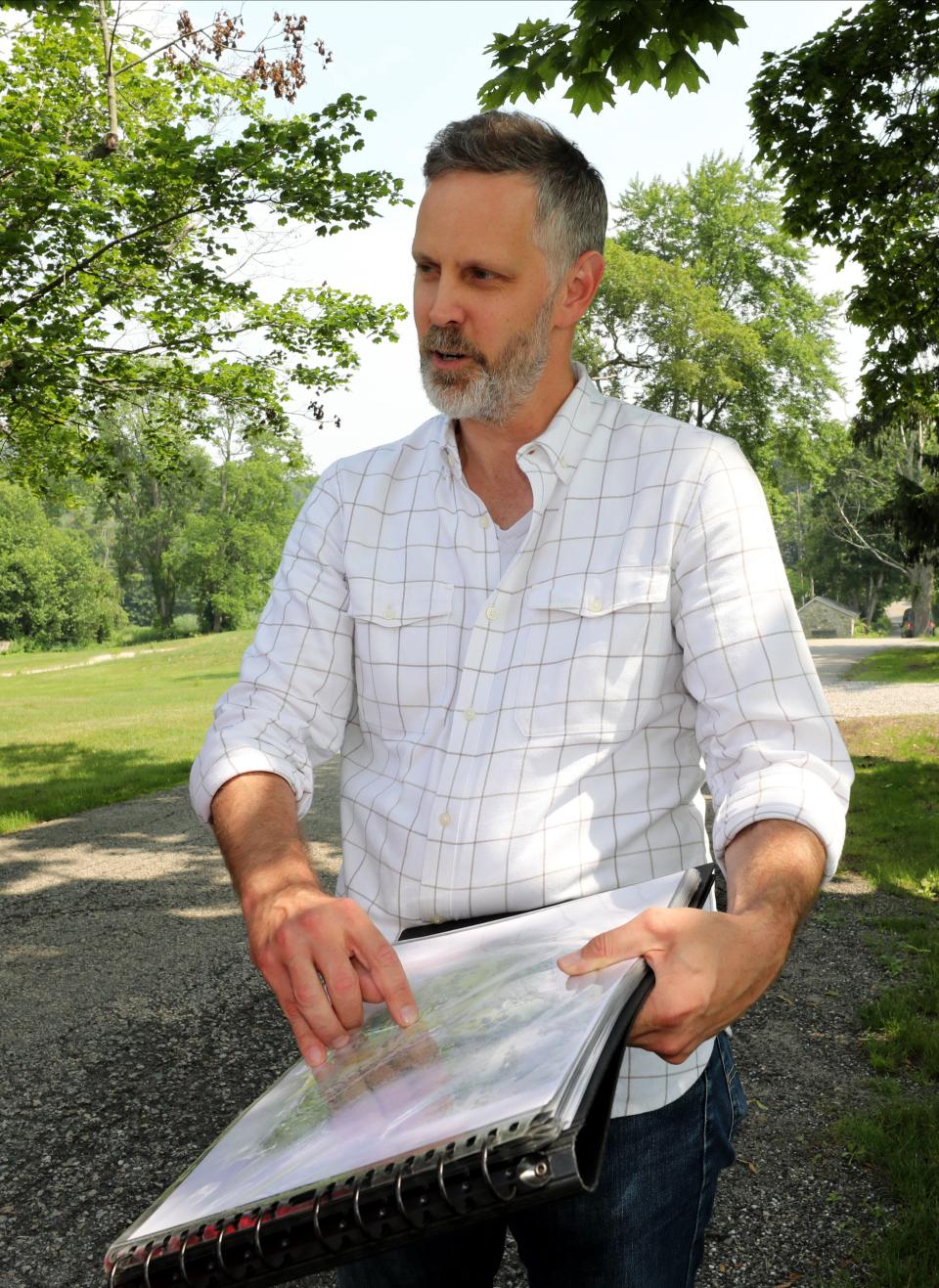 Davis McCallum, the artistic director of Hudson Valley Shakespeare Festival, discusses plans for a new permanent home for the festival last June. Gov. Kathy Hochul announced a $10 million state grant that will help the festival build a pavilion theater on a bluff overlooking the Hudson.