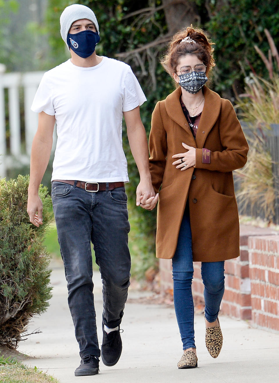 <p>Sarah Hyland and Wells Adams hold hands on a Tuesday walk through West Hollywood.</p>