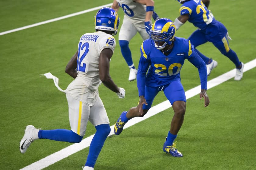 Los Angeles Rams cornerback Jalen Ramsey, right, defends wide receiver Van Jefferson.