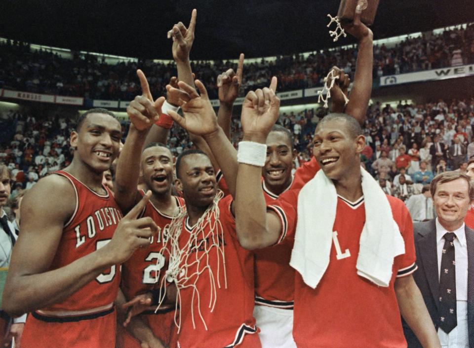 Members of the Louisville Cardinals flash the No. 1 sign after they defeated Duke at Reunion Arena to win the NCAA Championship in 1986 From left are Billy Thompson, Milt Wagner, Kevin Walls, David Robinson and Kenny Payne.