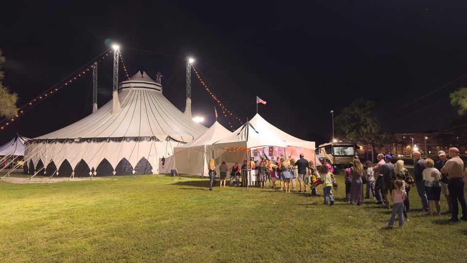 A line waits outside the tent of Cirque Ma'Ceo in England Brothers Park in Pinellas Park before the show starts on Friday, Feb. 24, 2023. Cirque Ma'Ceo is an equestrian-themed Cirque du Soleil style circus that travels across the United States.