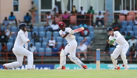 Cricket - West Indies v England - Second Test - National Cricket Ground, Grenada - 24/4/15 West Indies' Kraigg Brathwaite in action as England's Jos Buttler and Gary Ballance look on Action Images via Reuters / Jason O'Brien Livepic
