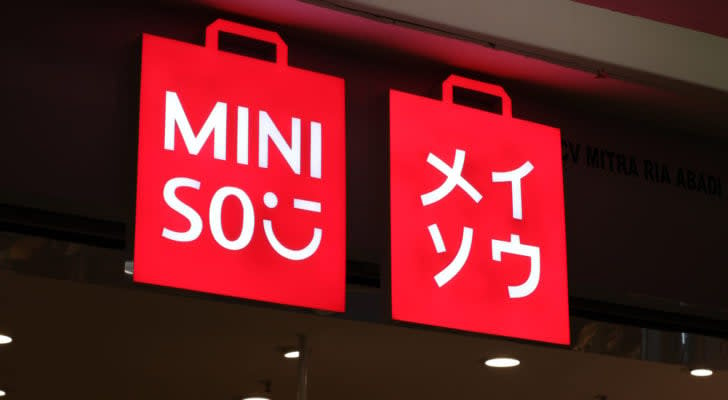 red Miniso (MNSO) sign glowing at night