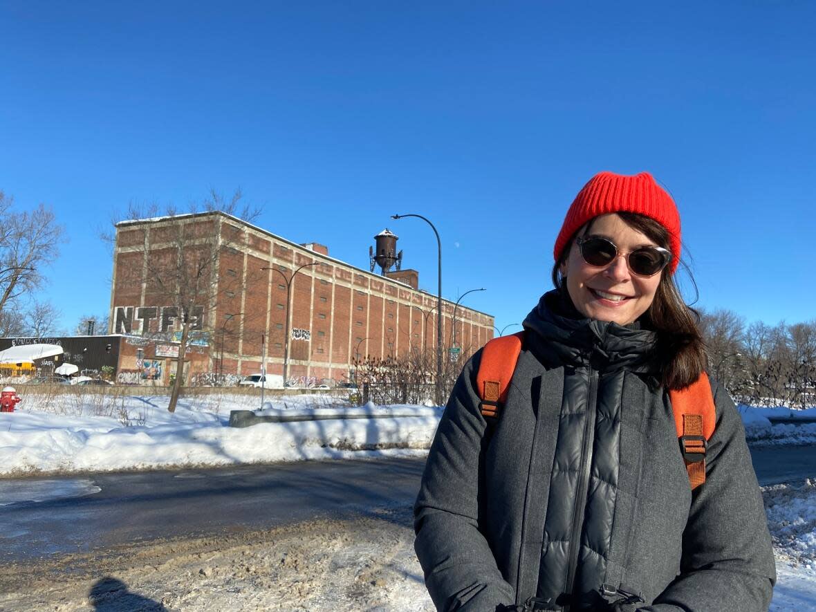 Coun. Marie Plourde, who has a background in urban planning, said the borough wants to hear what people think about plans for the building seen in the background. (Rowan Kennedy/CBC - image credit)