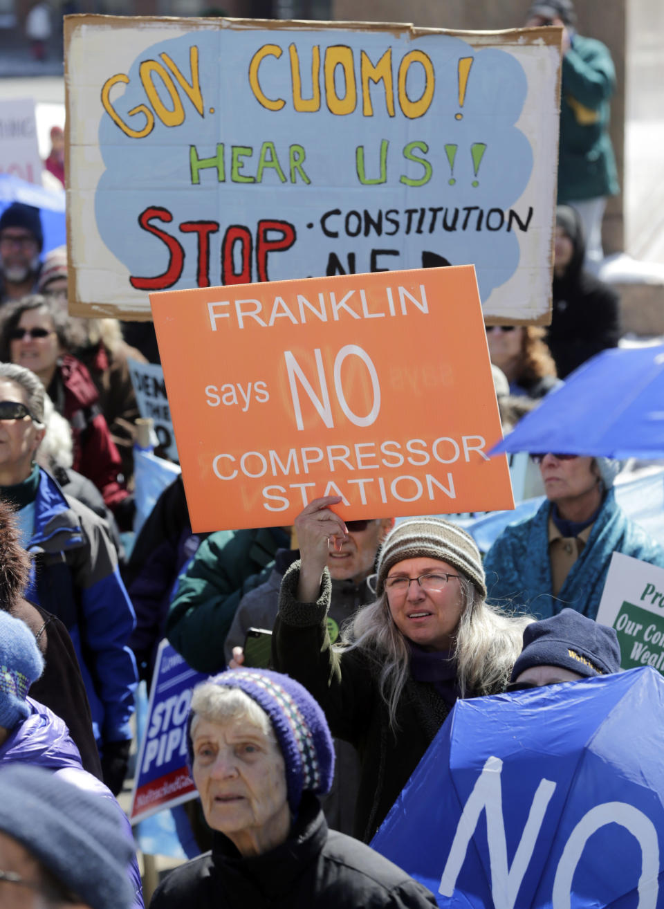 FILE - In this April 5, 2016 file photo, environmental groups opposing the Constitution Pipeline rally outside the state Capitol in Albany, N.Y. The nearly $1 billion Constitution Pipeline project that was designed to bring natural gas from Pennsylvania's shale gas fields to metropolitan New York and New England has been abandoned after years of legal regulatory challenges made it economically unfeasible, according to a statement Monday, Feb. 24, 2020 from a spokeswoman for project partner Duke Energy said Monday. (AP Photo/Mike Groll, File)