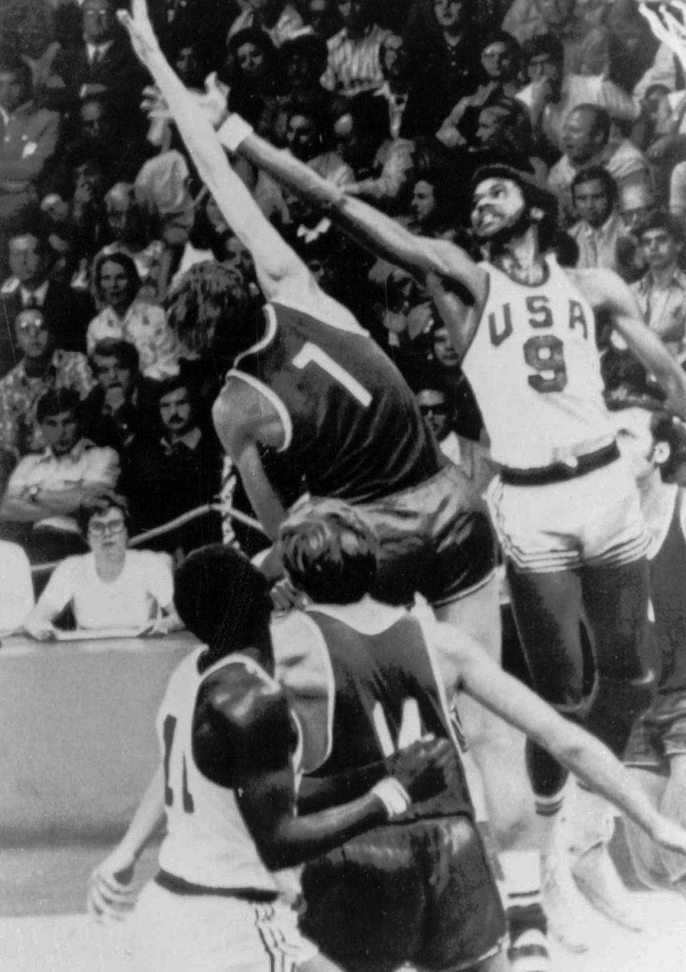 FILE - United States' Dwight Jones tries to grab the ball as a Russian player goes for a score during the men's basketball final at the Olympic Games in Munich on Sept. 10, 1972. Russia won 51-50 to win the gold medal. Members of the 1972 team have talked about finally retrieving those silver medals they vowed to never accept and left behind in Germany. No, they still don't want them for themselves. They believe the medals belong in the Naismith Memorial Basketball Hall of Fame, but the latest attempt to get them from the International Olympic Committee has been thwarted. (AP Photo, File)