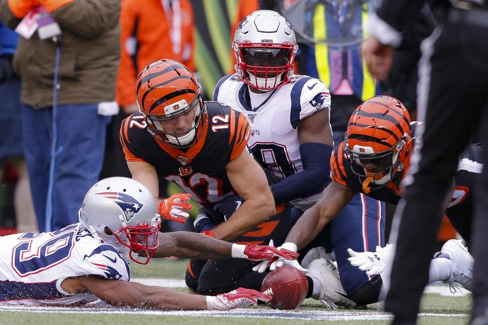 Cincinnati Bengals wide receiver Alex Erickson (12) fumbles a punt for a New England Patriots recovery in the first half of an NFL football game, Sunday, Dec. 15, 2019, in Cincinnati. (AP Photo/Gary Landers)