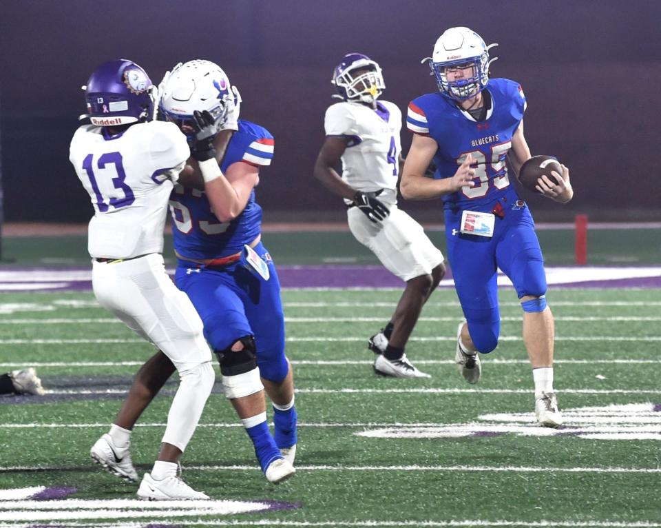 Coleman's Hunter Lackey, right, looks for running room against Marlin. The Bulldogs beat Coleman 30-28 in a Region II-2A Division I area playoff game Thursday, Nov. 16, 2023, at Tarleton Memorial Stadium in Stephenville.