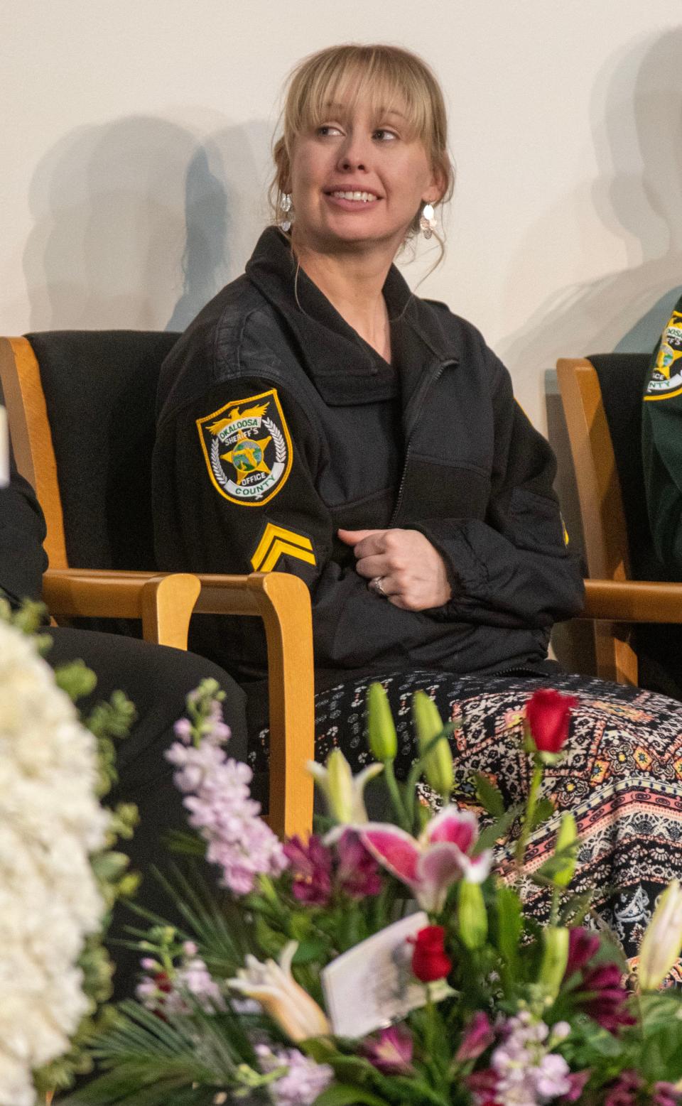 Renee Hamilton listens to stories about her husband during the Visitation and Celebration of Life for Okaloosa Deputy Ray Hamilton at Destin-Fort Walton Beach Convention Center Saturday, December 31, 2022. Deputy Hamilton was killed in the line of duty December 24, 2022.
