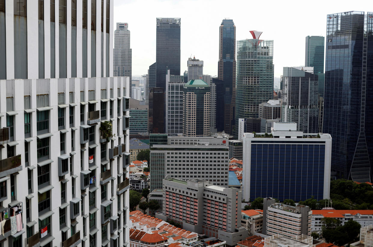 A view of the Pinnacle at Duxton HDB blocks beside the central business district and private properties in Singapore. This image illustrates a story on the rise of property tax.