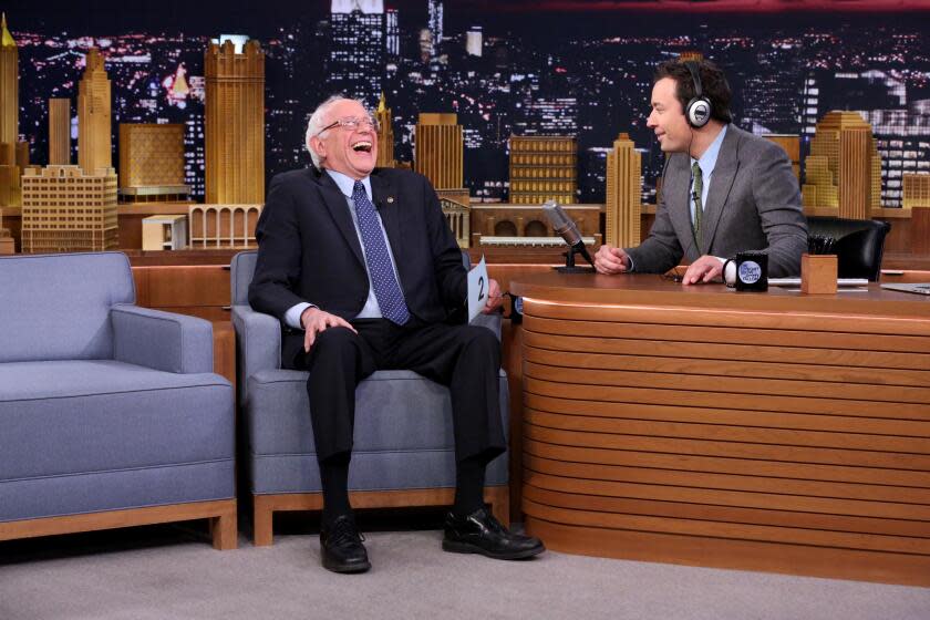 THE TONIGHT SHOW STARRING JIMMY FALLON -- Episode 0383 -- Pictured: (l-r) Senator Bernie Sanders and host Jimmy Fallon play The Whisper Challenge on December 8, 2015 -- (Photo by: Douglas Gorenstein/NBCU Photo Bank/NBCUniversal via Getty Images via Getty Images)
