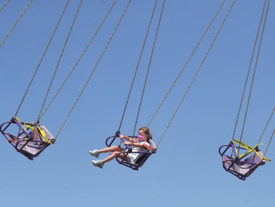 Katherine Brister 5, of Stow rides the YoYo at the Summit County Fair on Wednesday, July 29, 2020, Tallmadge, Ohio.