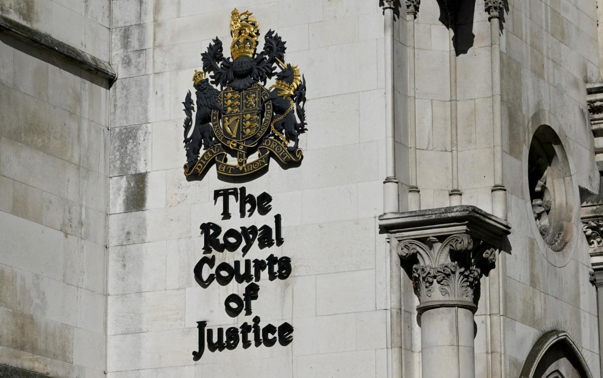 A general view shows a signage at the High Court in London