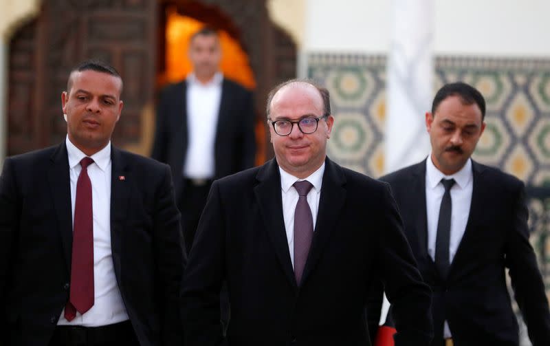 Tunisian Prime Minister Elyes Fakhfakh leaves for a meeting with Tunisian President Kais Saied in Tunis