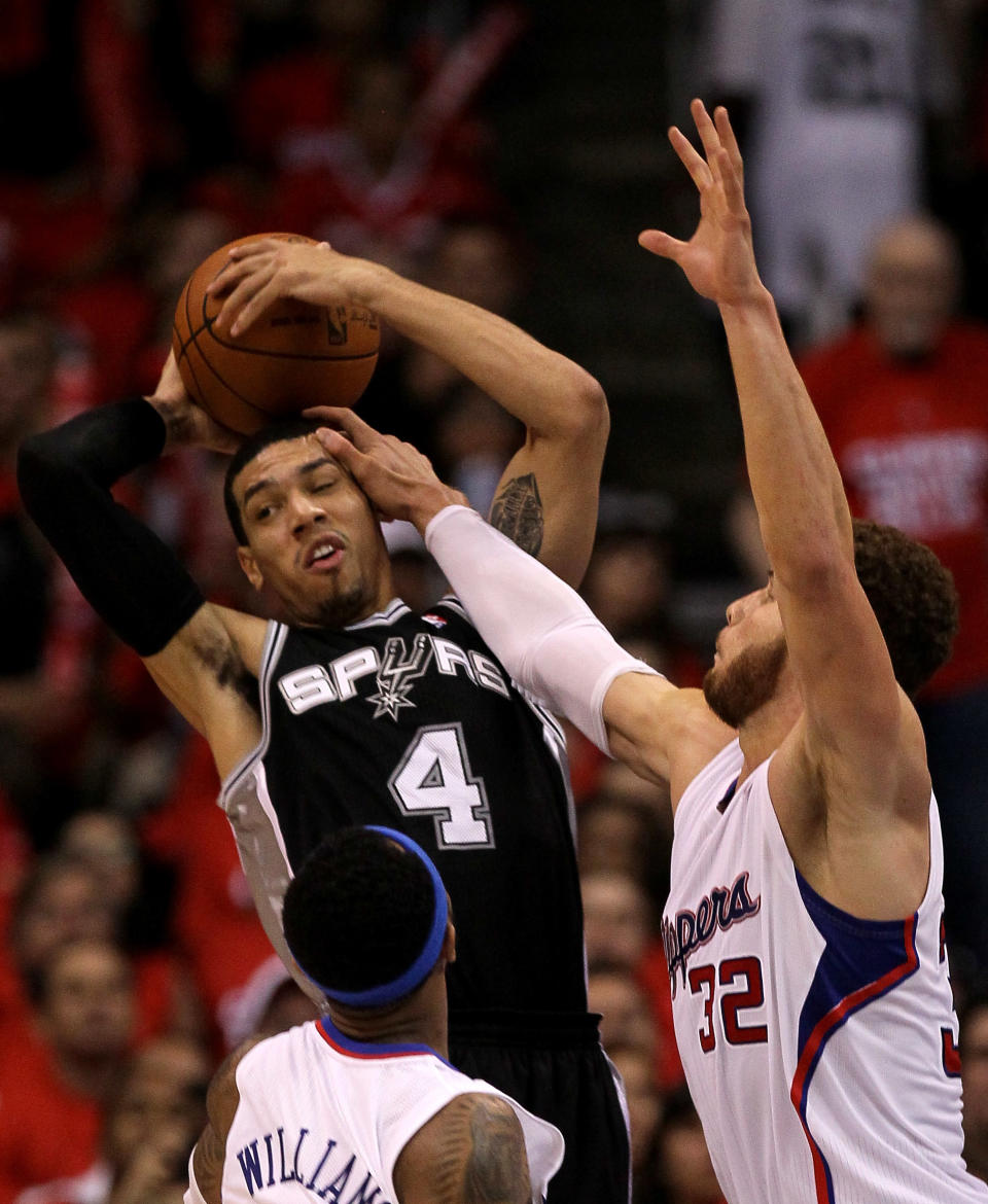 LOS ANGELES, CA - MAY 19: Danny Green #4 of the San Antonio Spurs and Blake Griffin #32 of the Los Angeles Clippers contend for the ball in Game Three of the Western Conference Semifinals in the 2012 NBA Playoffs on May 19, 2011 at Staples Center in Los Angeles, California. The Spurs won 96-86 to take a three games to none lead in the series. NOTE TO USER: User expressly acknowledges and agrees that, by downloading and or using this photograph, User is consenting to the terms and conditions of the Getty Images License Agreement. (Photo by Stephen Dunn/Getty Images)