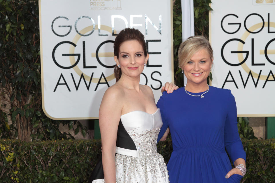 Actress and Co-Host Tina Fey and Amy Poehler arrive at the 72nd Annual Golden Globe Awards held at the Beverly Hilton Hotel in Los Angeles, CA on January 11, 2015. (Photo By Adam Orchon) *** Please Use Credit from Credit Field ***