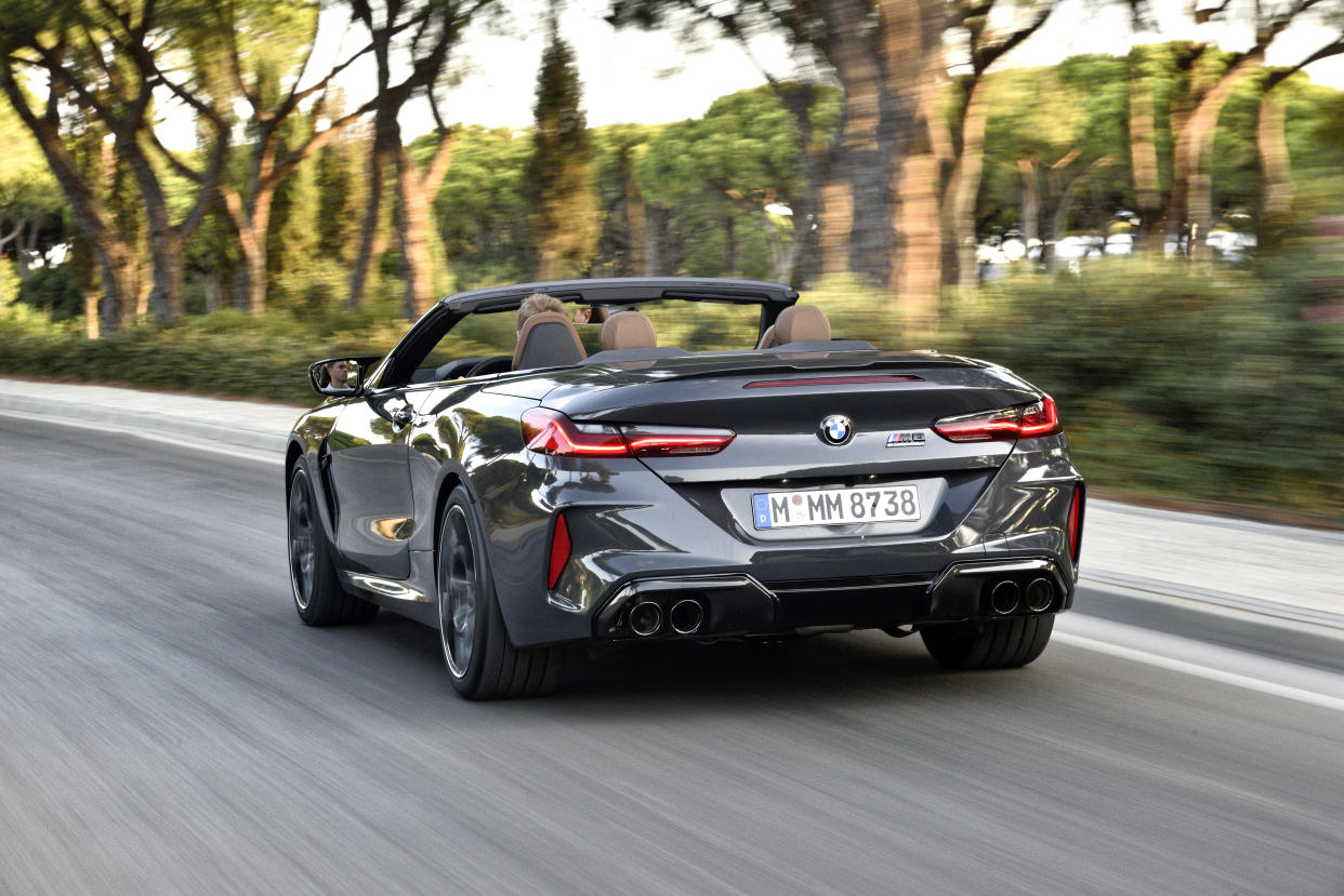 Quad exhaust pipes feature at the rear of the car