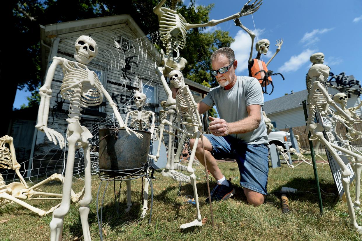 Ed Stark works on Halloween decorations in his yard on Eastman Avenue in Springfield Tuesday, Sept. 12, 2023.