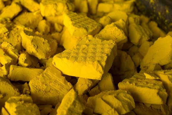 A heap of yellow uranium cakes.