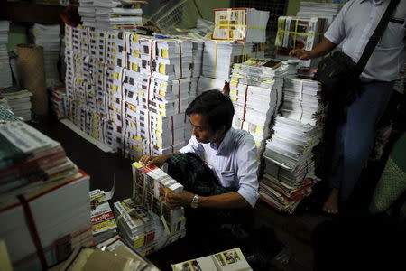 Staff members pack copies of the Thargi Nwe Thway journal promoting nationalism published by Ma Ba Tha to be delivered around the country at a warehouse at Ma Ba Tha's head office in Yangon August 26, 2015. REUTERS/Soe Zeya Tun