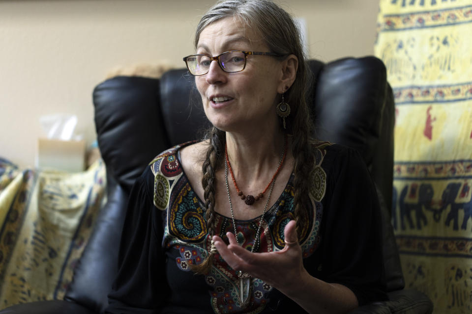 Cathy Jonas, owner of Epic Healing Eugene, speaks during an interview on Friday, Aug. 4, 2023, in Eugene, Ore. (AP Photo/Jenny Kane)