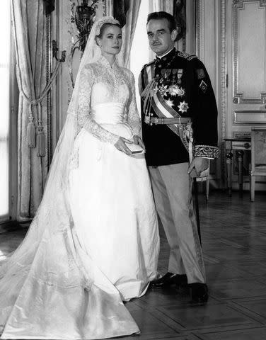 <p>AFP/Getty</p> Grace Kelly and Prince Rainier of Monaco on their wedding day in 1956