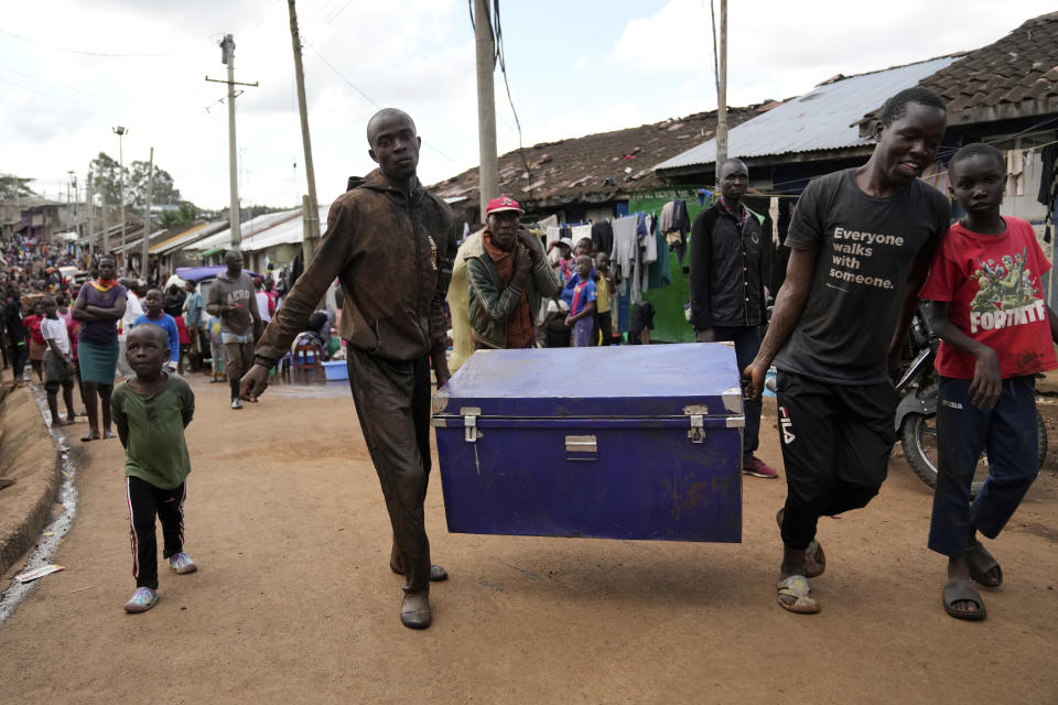 Residents remove belongings from their flooded homes, after heavy rain in the Mathare slum of Nairobi, Kenya, Wednesday, April 24, 2024. Heavy rains pounding different parts of Kenya have led to dozens of deaths and the displacement of tens of thousands of people, according to the U.N., citing the Red Cross. (AP Photo/Brian Inganga)