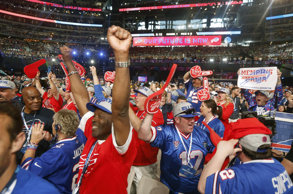 FILE - Buffalo Bills fans celebrate their selection of Wyoming's Josh Allen during the first round of the NFL football draft, Thursday, April 26, 2018, in Arlington, Texas. (AP Photo/Michael Ainsworth, File)